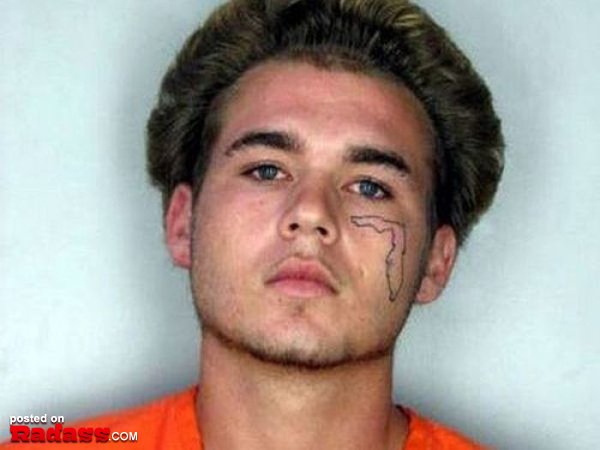 A man with regrettable facial tattoos.