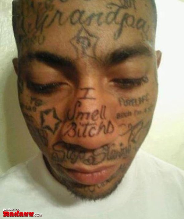 A man with regrettable tattoos on his face.