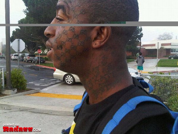 A man with a regrettable face tattoo.