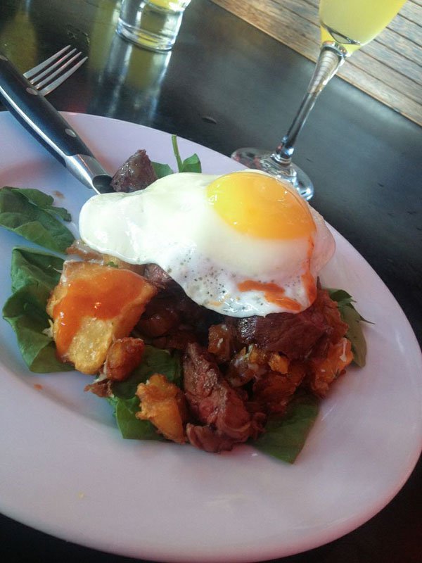 A mouthwatering plate of food featuring a delectable egg.