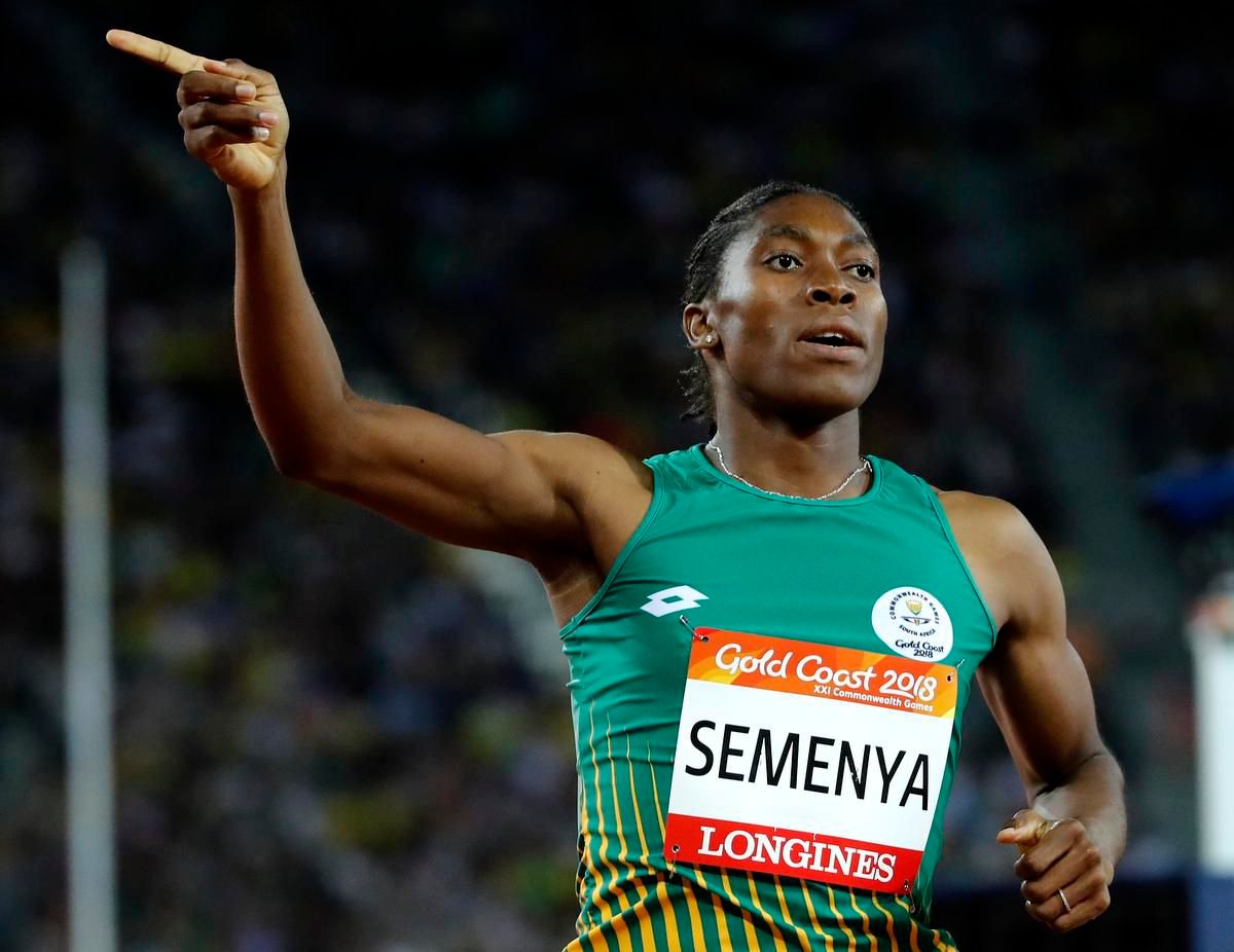 Female athlete, pointing finger.