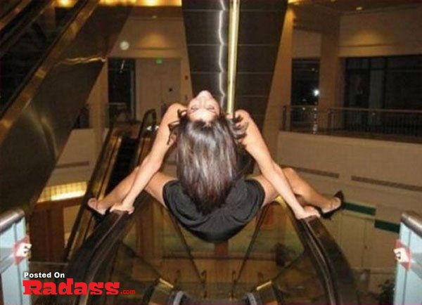 girl-you-are-strange-16 Two women sharing joy and affection on the dance floor at a wedding during their weekend celebration, captured in heartfelt embraces.