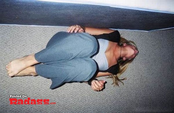 girl-you-are-strange-24 A black and white photo of a woman sitting on the floor holding a bottle from the