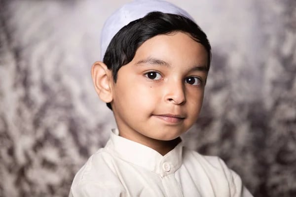 depositphotos 372518810 stock photo muslim child portrait looking camera rehman quran and computer academy