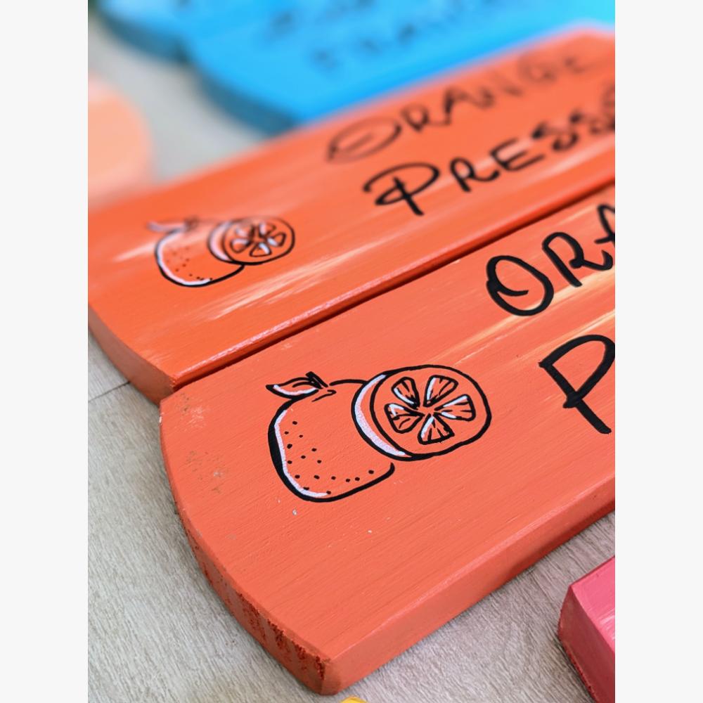 pancarte-panneau-signalétique-coloré-peps-personnalisé-été-commerce Plaques oranges avec dessins de tranches d'oranges