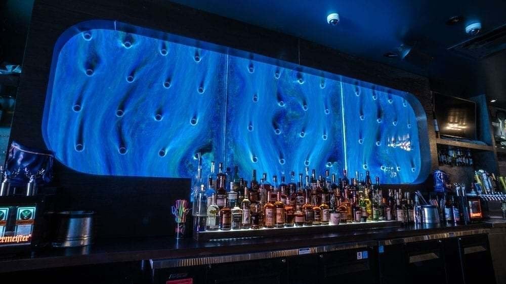Everything You Need To Know About Indoor Water Walls For Businesses 1 Bubble Wall Rod Peg Style Swirley at Courduroy Bar in Las Vegas Nevada 21