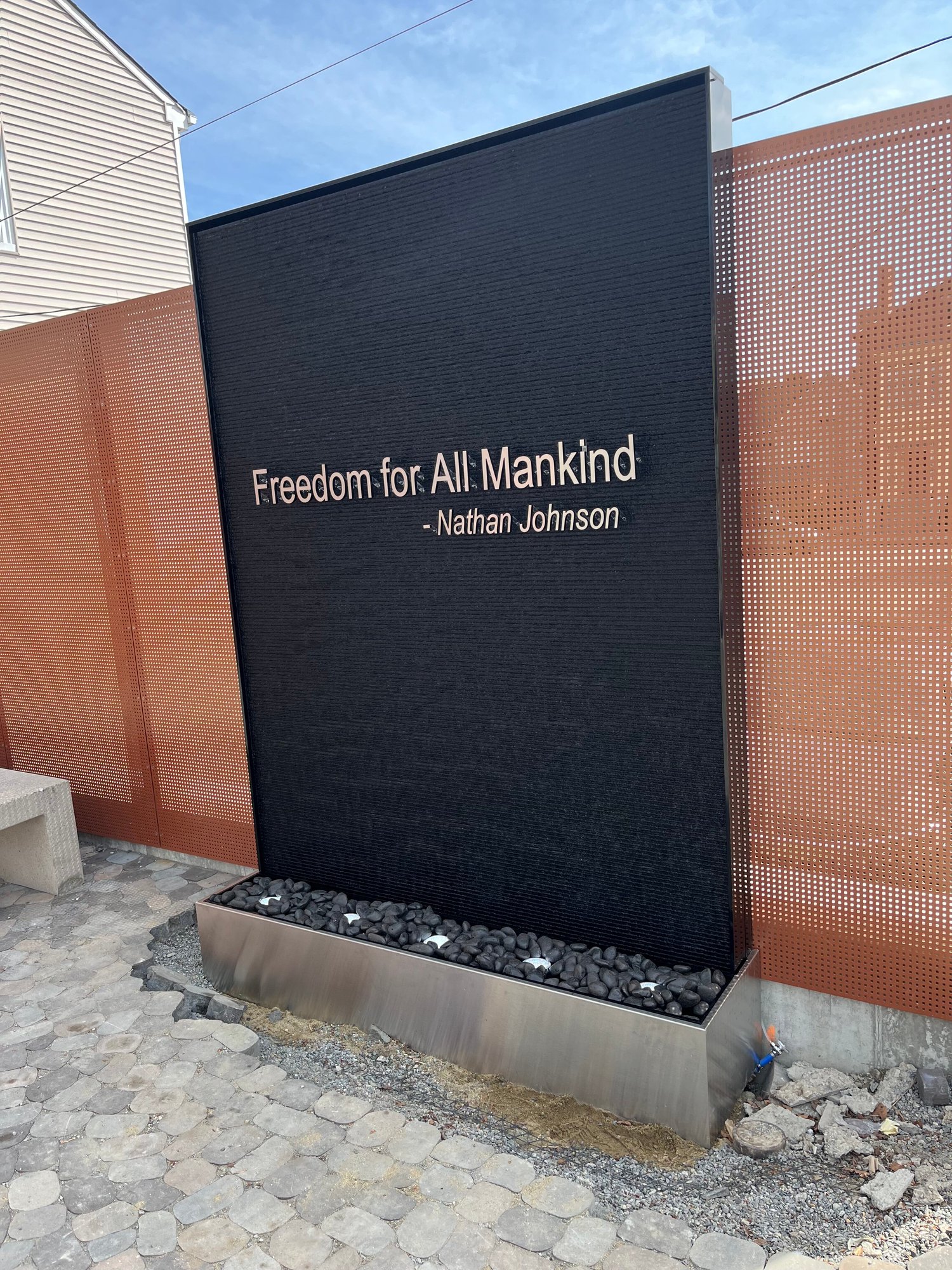 Outdoor Black Scored Acrylic Water Wall with Logo for Abolition Row Park in New Bedord, Massachusetts - Image 3