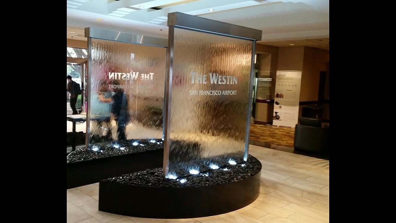 Video Custom Glass Waterfall Walls at Westin Hotel at San Francicso Airport-Water Walls with Etched Logo Video Custom Glass Waterfall Walls at Westin Hotel at San Francicso Airport-Water Walls with Etched Logo