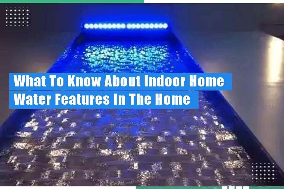 Indoor water feature with illuminated blue waterfall, emphasizing benefits of indoor water features in home decor.