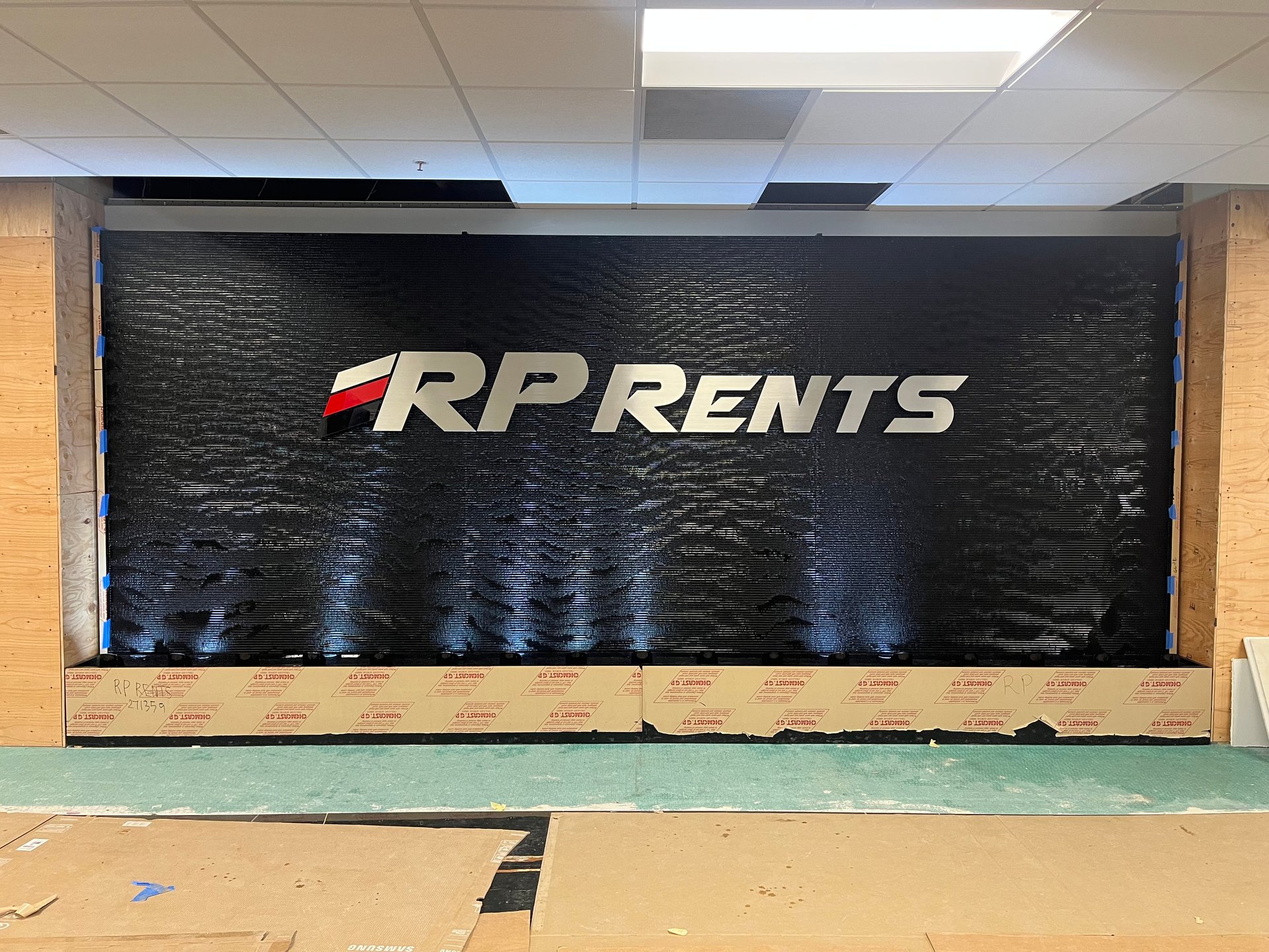 Black Scored Acrylic Water Wall with Logo for RP Rents in Naperville,, Illinois - Image 2