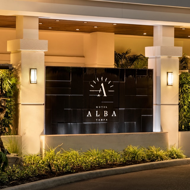 Logo Fountains 82 Black acrylic water wall with illuminated "ALBA" logo at Hotel Alba entrance in Tampa, Florida, enhancing aesthetic appeal and branding for commercial spaces.