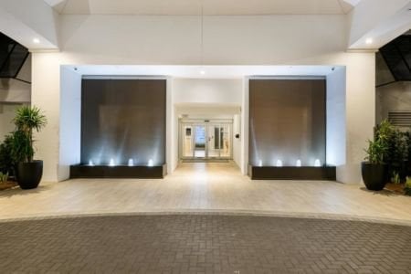 Brown Copper Painted Scored Acrylic Aquafalls with Reflection Pool Basin and Bubbler Jets at Beachcomber Resort Club in Pompano Beach Florida