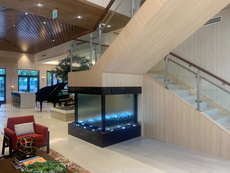 Glass Water Wall with Powdercoated Brown Painted Finish under Stars at The Residences at Monterra Commons in Cooper City (miami), Florida Glass Water Wall with Powdercoated Brown Painted Finish under Stars at The Residences at Monterra Commons in Cooper City (miami), Florida