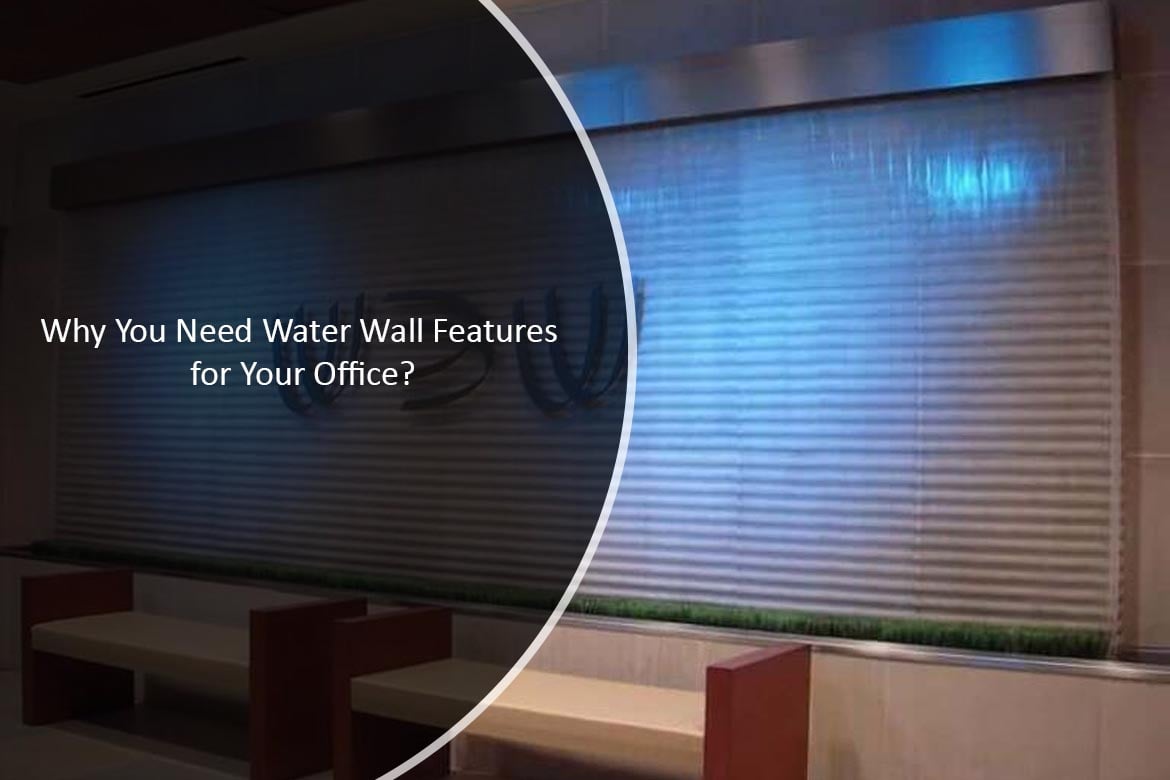 Water wall feature in an office setting, showcasing calming water flow over a textured surface, with seating area and greenery visible, emphasizing tranquility and elegance for indoor spaces.