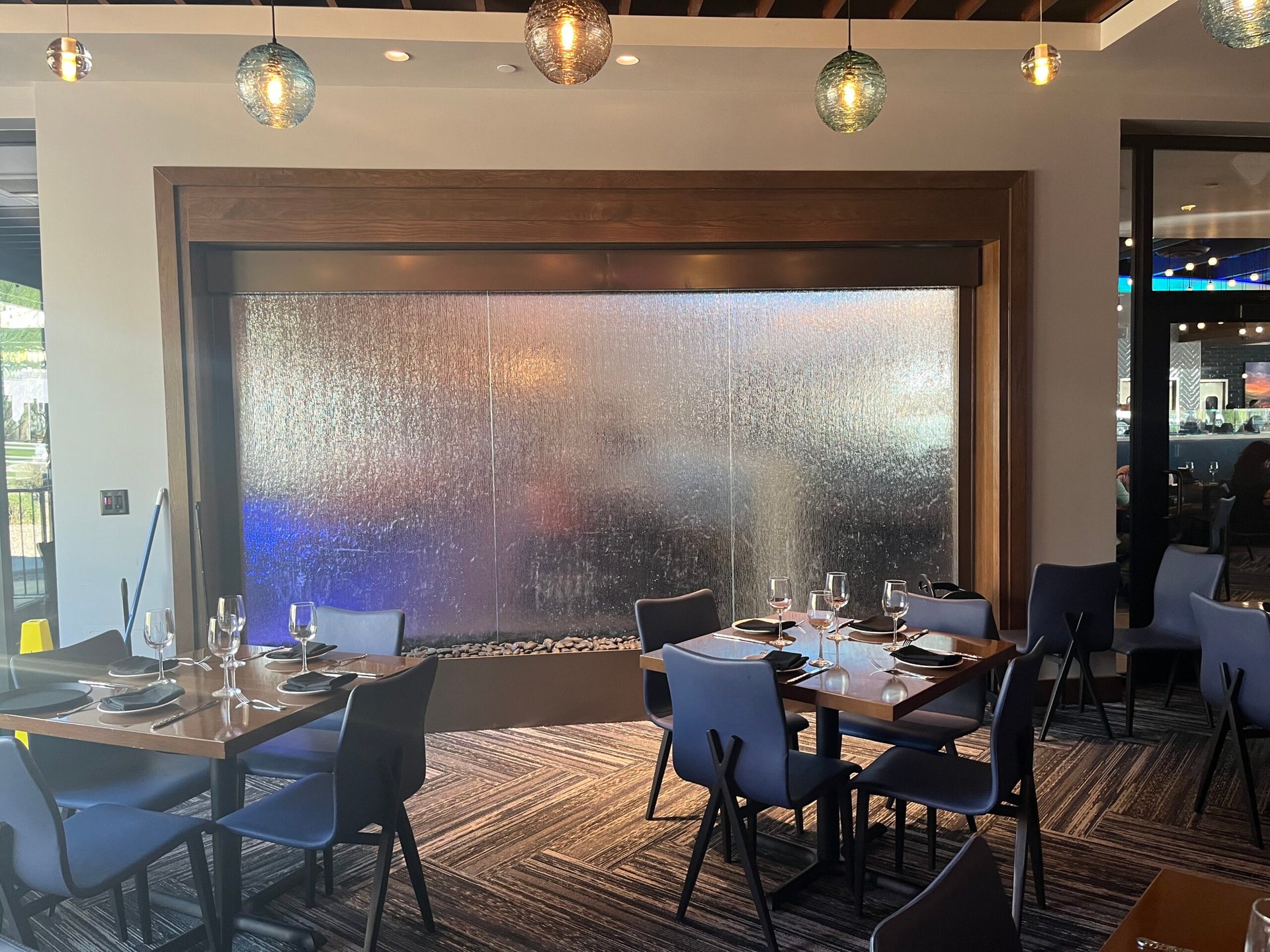 Glass Water Features 64 Textured Glass Water Wall with Brown Powdercoated Stainless Steel Frame for Kona Grill Desert Ridge in Phoenix Arizona scaled