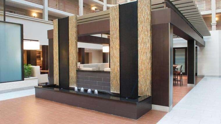 How Water Features Enhance The Hotel Guest Experience 2 Black Scored Acrylic Water Wall Aquafall with Reflection Pool and Bubbler Jets at Embassy Suites Denver Colorado