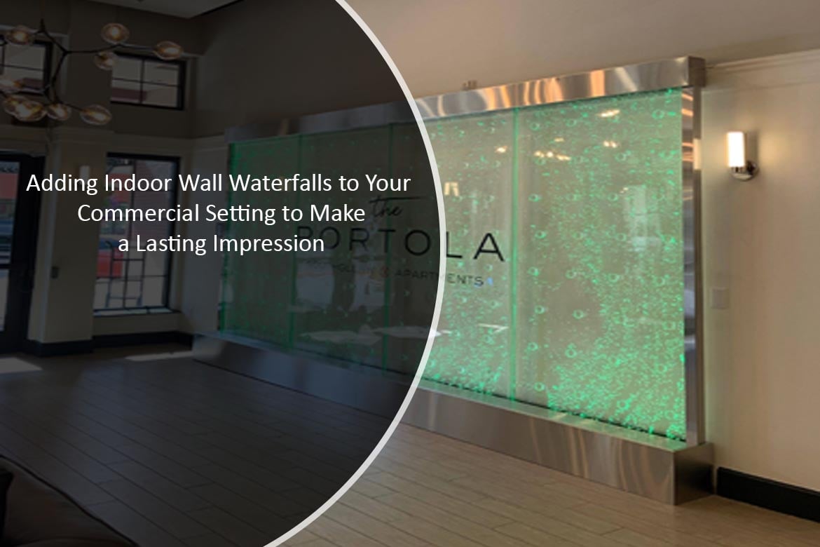 Indoor wall waterfall installation with illuminated water bubbles, enhancing commercial space ambiance for lasting impressions at The Portola Apartments.