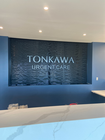 Black Scored Acrylic Water Wall with Tonkawa Northern Oklahoma Urgent Care in Tulsa, Oklahaoma