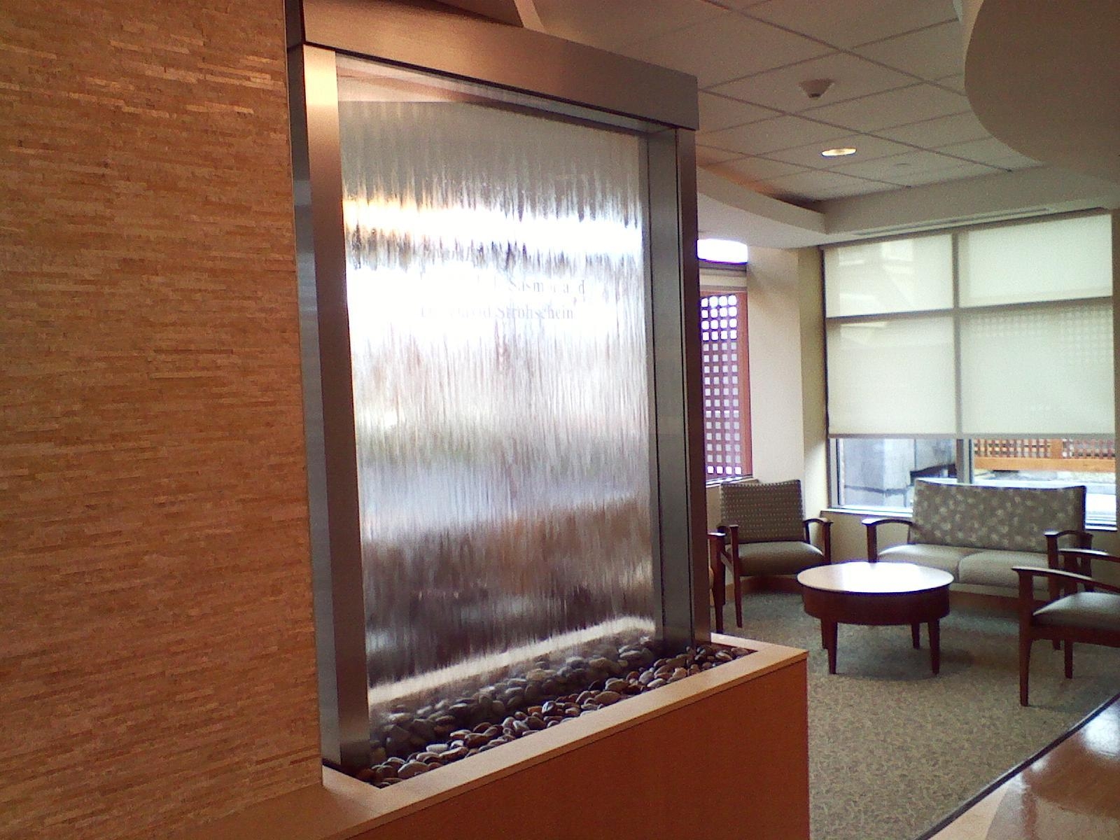 Enclosed glass waterfall