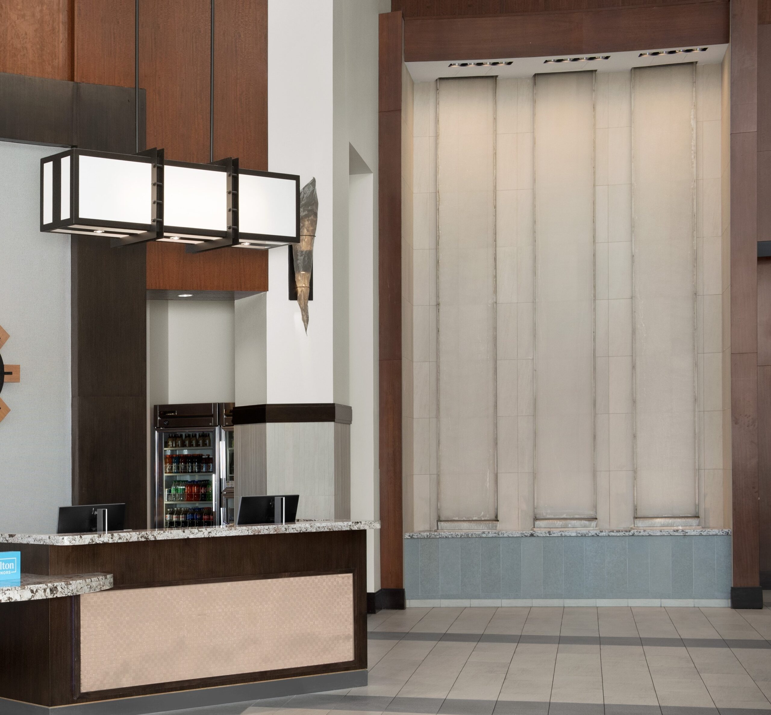 Specialty Fountains 40 Frameless Glass Acrylic Water Wall with Weirs into Reflection Pool at Embassy Suites Springfield Virginia scaled