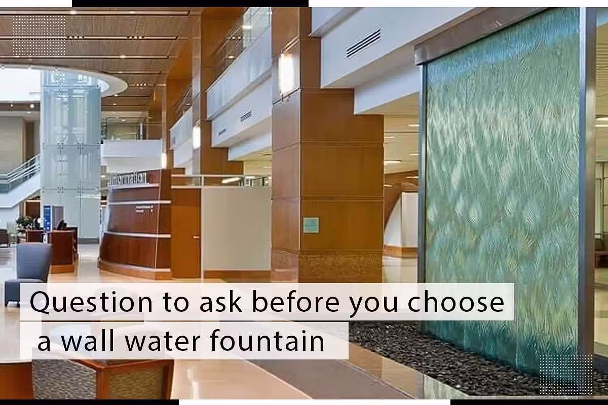 Wall water fountain in modern indoor setting, featuring textured glass and stone base, with overlay text "Question to ask before you choose a wall water fountain," highlighting design considerations for water features in spaces.