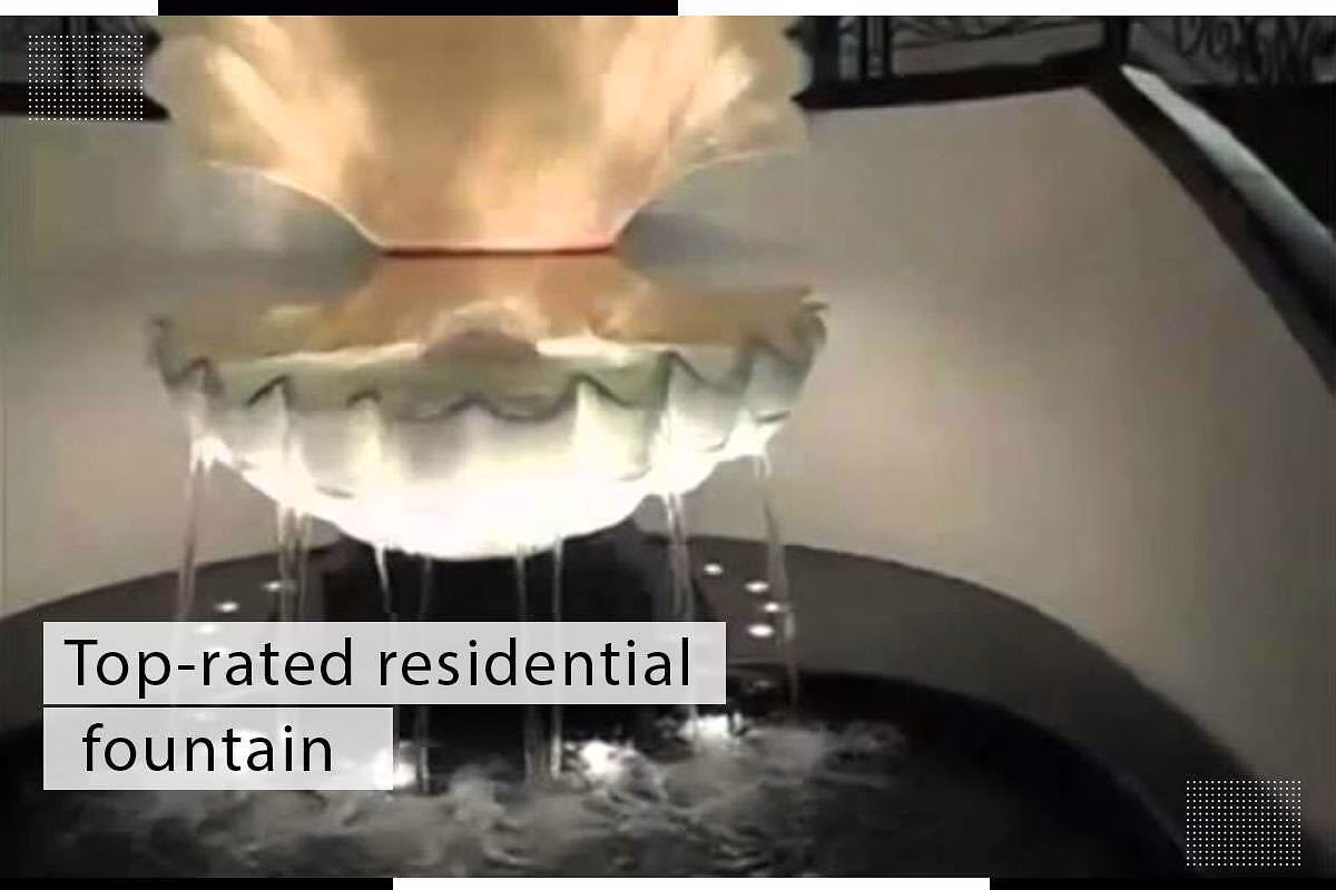 Top-rated residential fountain with flowing water and illuminated basin, enhancing indoor decor and tranquility.