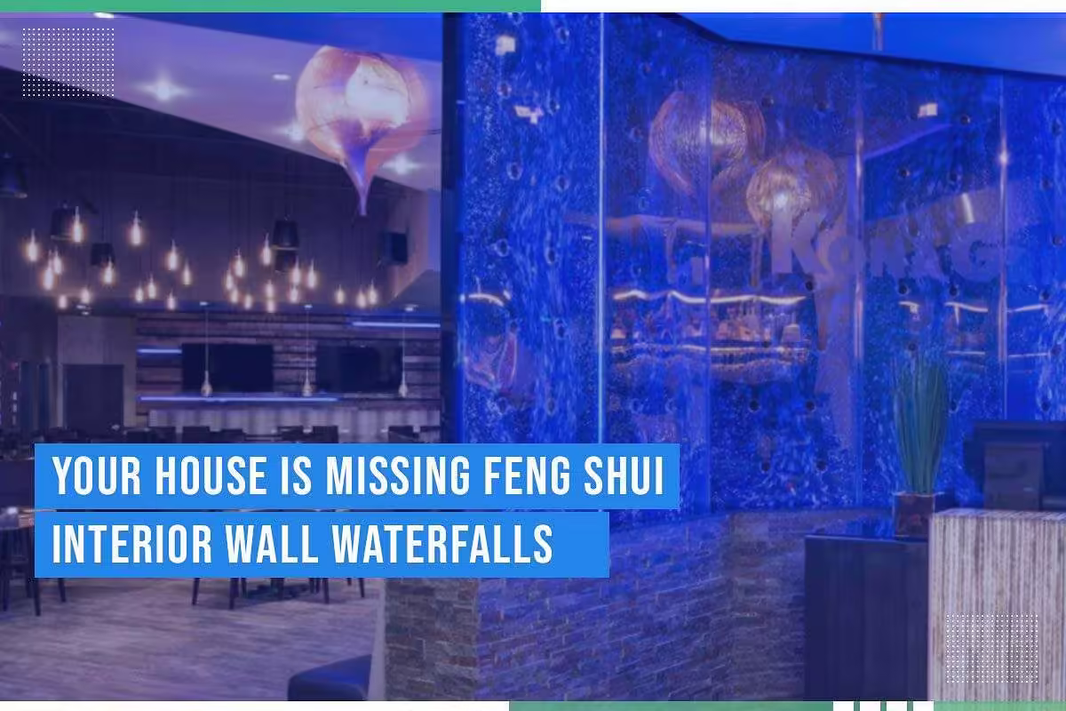 Interior wall waterfall featuring blue water flow, modern decor, and ambient lighting, emphasizing Feng Shui design principles for enhancing commercial spaces.
