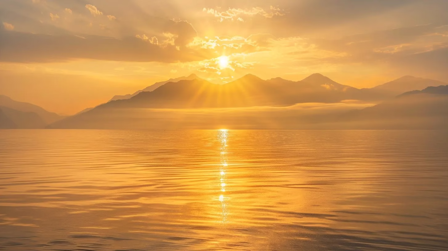 Exploring the Unique Aspects of Water's Composition 1 a serene sunrise casts golden hues over a tranquil lake, where mist gently rises from the water's surface, creating a peaceful atmosphere that invites reflection.