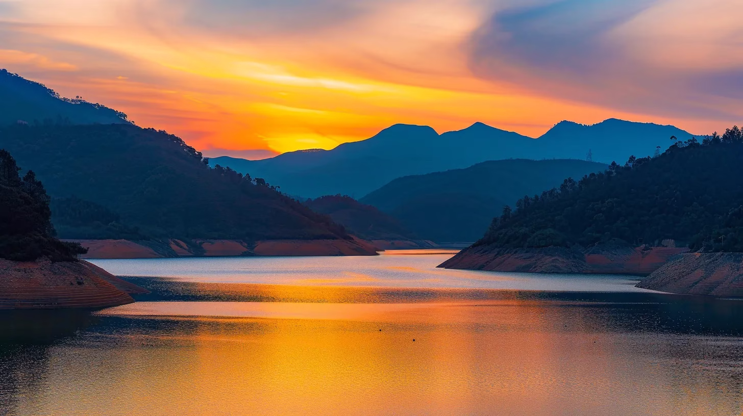 Unique Metal Fountain Ideas for Garden Aesthetics 3 a vibrant sunset casts a golden glow over a serene lake surrounded by majestic mountains, reflecting the brilliant colors in the calm water below.