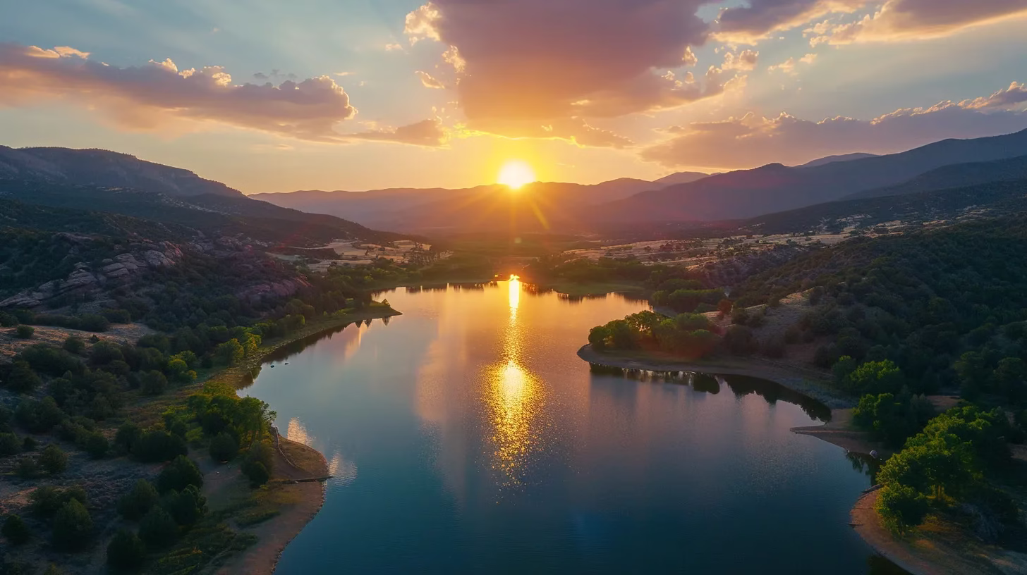 Designing a Rain Wall: Tips and Inspiration 5 a breathtaking landscape features a vivid sunset casting warm, golden hues over a tranquil lake reflecting the majesty of surrounding towering mountains.