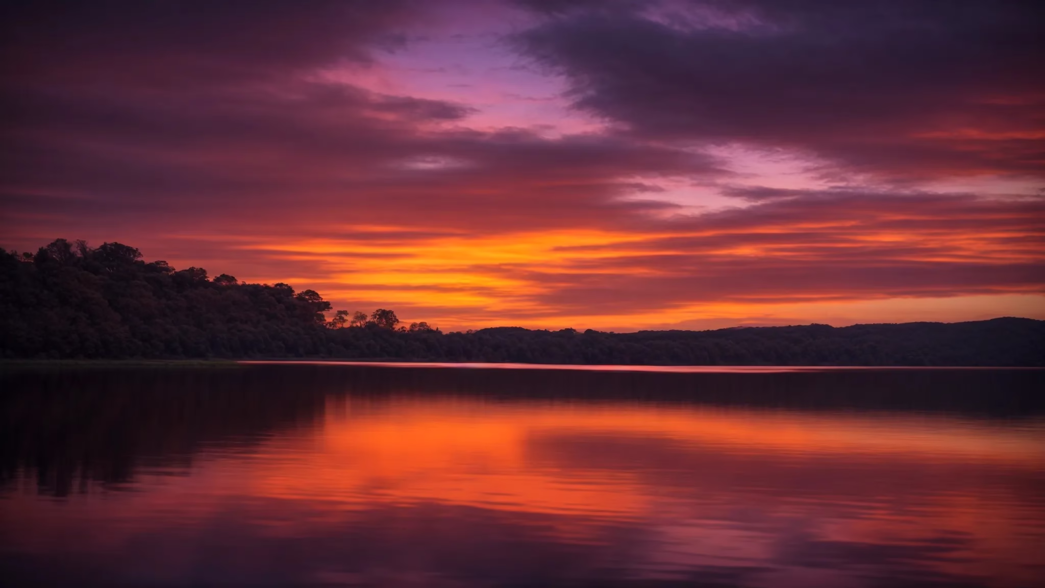 Ways to Add Charm to Your Small Garden Space 3 a majestic sun setting over a tranquil lake, casting vibrant hues of orange and purple across the sky, while its reflection shimmers on the water's surface, creating a serene atmosphere.