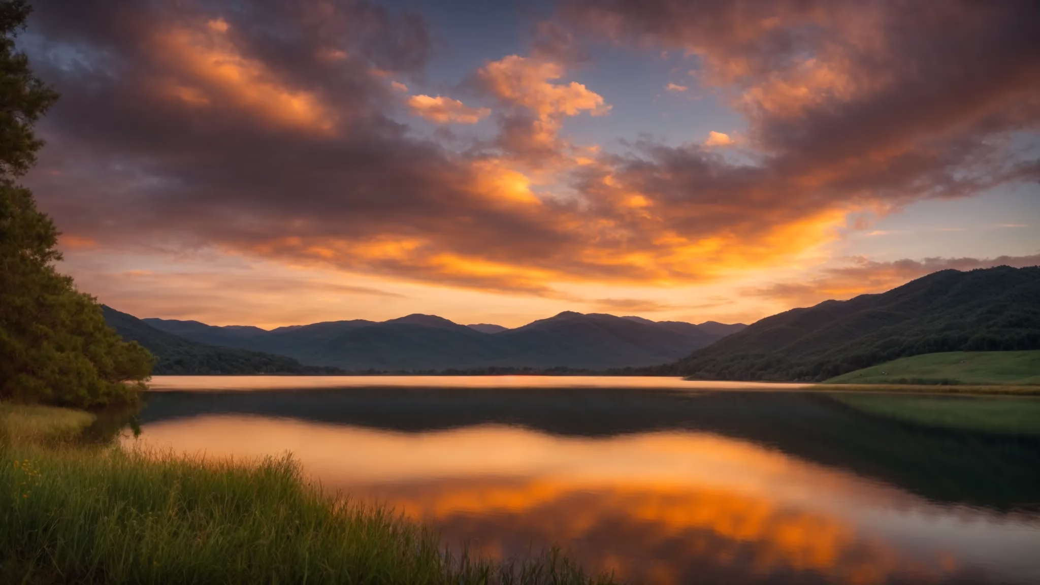 The Allure of an Exterior Waterfall in Landscaping 3 a vibrant sunrise casts a golden glow over a serene landscape, where lush rolling hills gently cradle a tranquil lake reflecting the colorful sky.