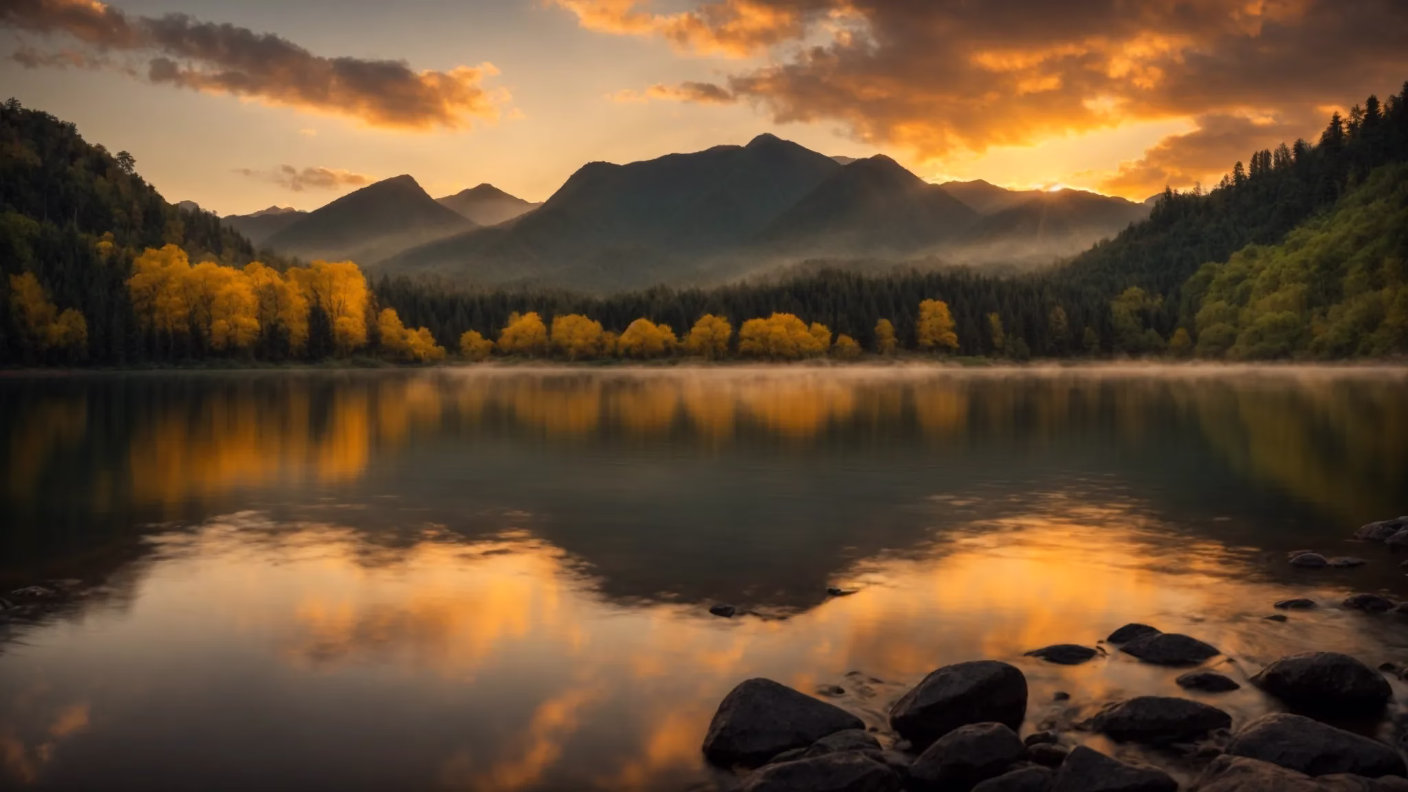 Enhance Your Yard With Beautiful Outdoor Waterfalls for Sale 4 a vibrant sunrise casts golden rays over a tranquil lake, reflecting the surrounding lush green mountains and creating a serene atmosphere of natural beauty.