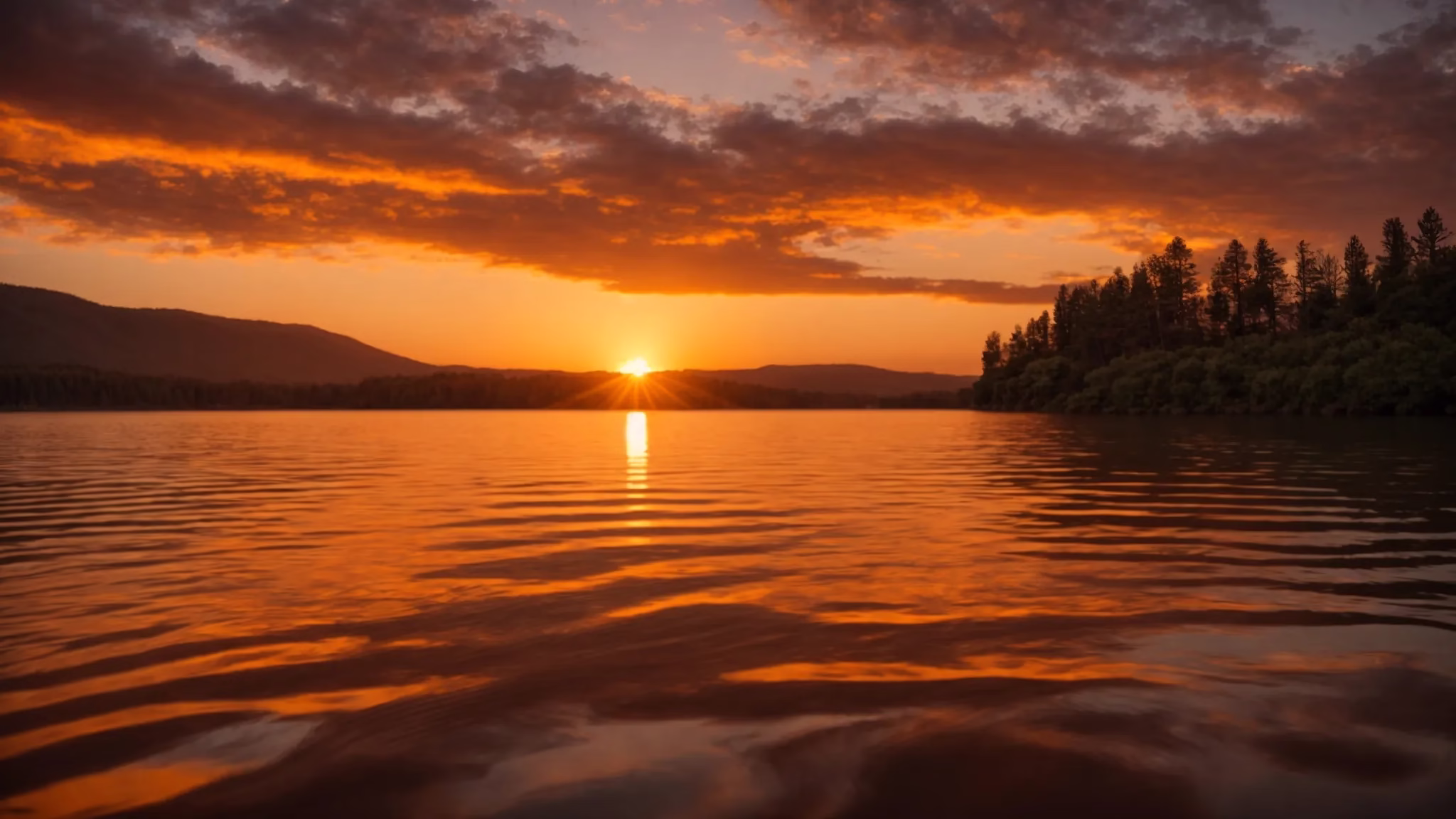 Elevate Your Outdoor Space With Stone Garden Fountains 4 a vibrant sunset casts a golden hue over a serene lake, where soft ripples reflect the fiery colors of the sky, creating a tranquil and idyllic atmosphere.
