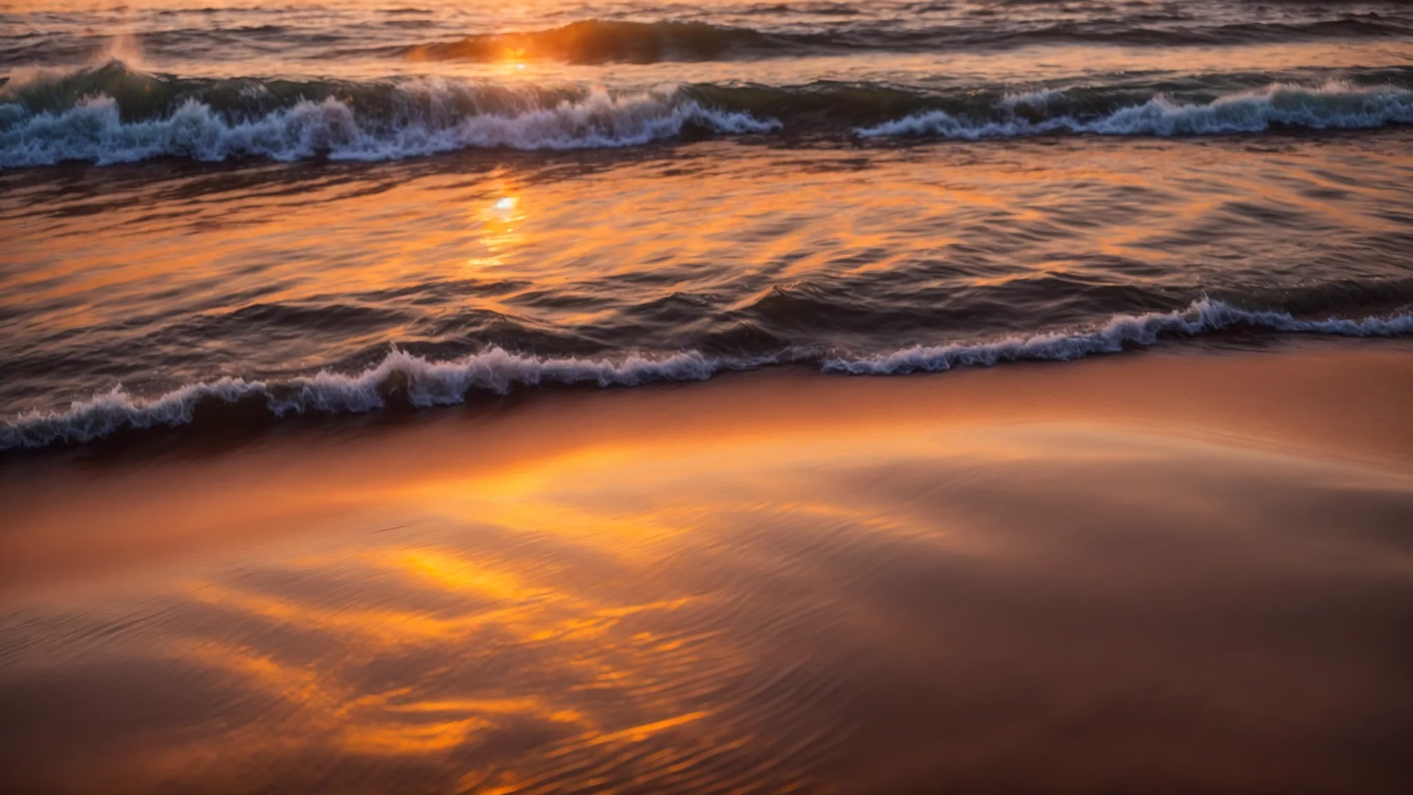 Reasons to Use Glass Water Containers Daily 4 a vibrant sunset illuminates a tranquil beach, casting a golden hue over gentle waves as reflections shimmer on the wet sand.