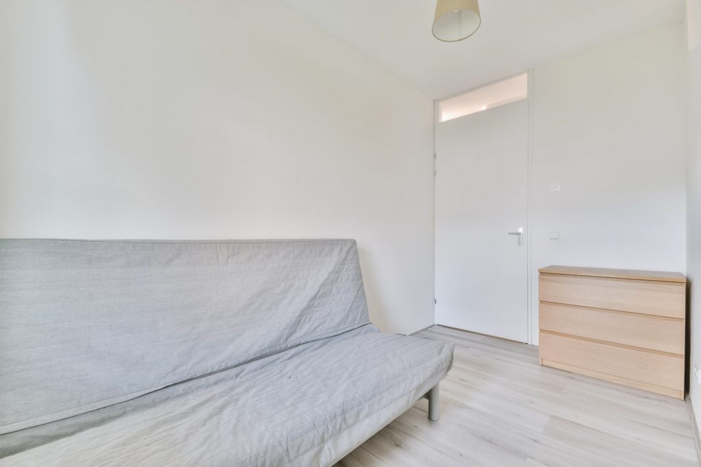 A small lounge room with a sofa