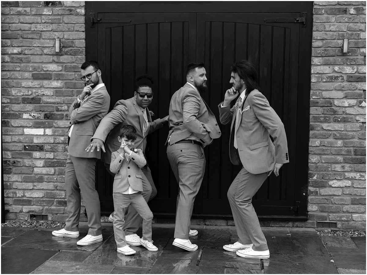 groomsmen fun black and white wedding photo