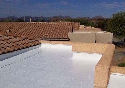 flat roof repair and coating flat roof repair and coating on a Tucson house