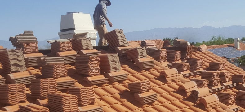 roofing contractor Tucson Tucson roofing contractor installing tile roof