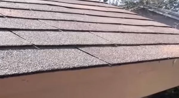 roofing contractor Tucson inspecting an asphalt shingle roof in Tucson