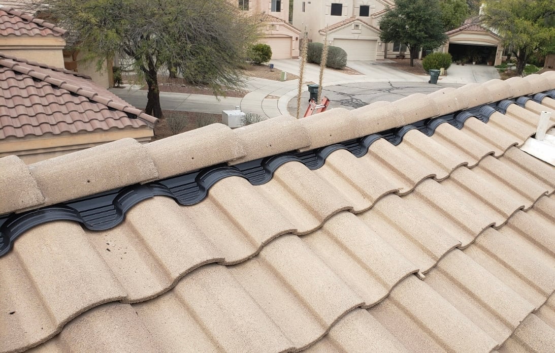 Professionally tiled roof by DC Roofing top of a tile roof being inspected