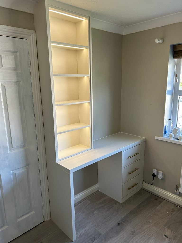 A custom-designed bookcase that incorporates a sleek desk.