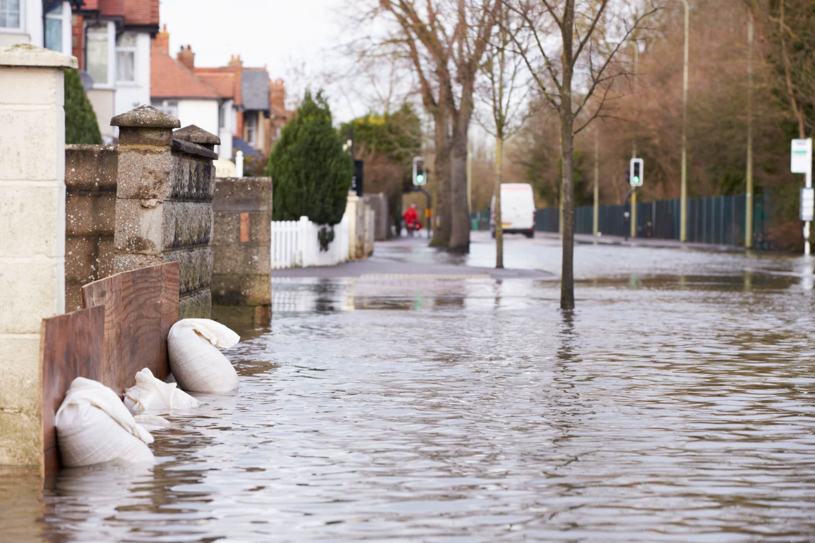 Sandbags Outside House On Flooded Road Sandbags Outside House On Flooded Road