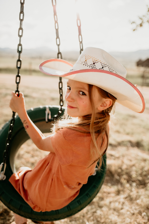 6G4A3263 Little girl in tire swing portrait