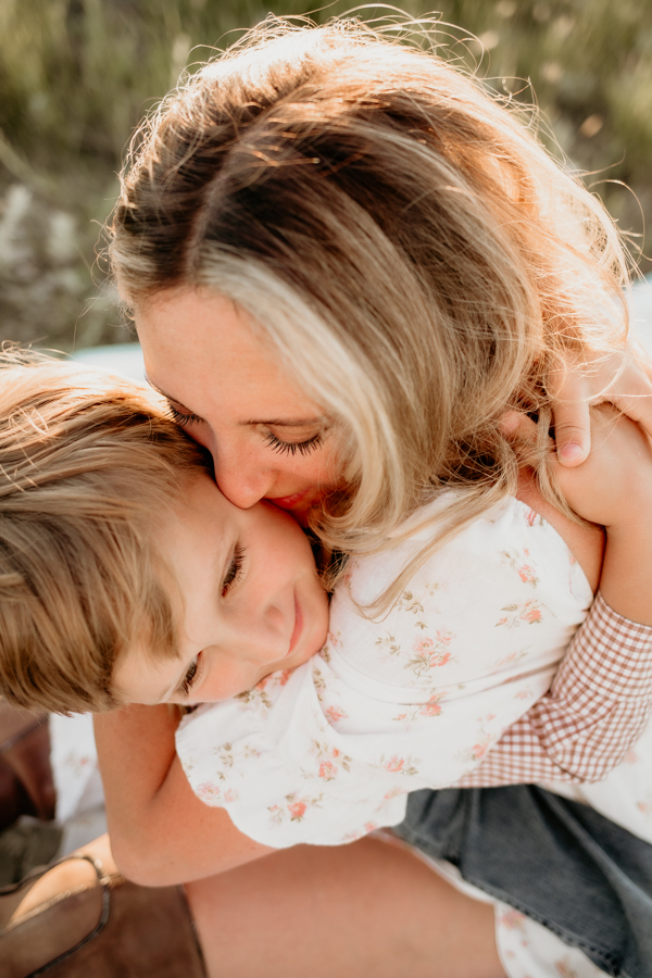 6G4A3541 Lifestyle mother kissing son portrait