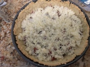 egg filling over bacon and cheese