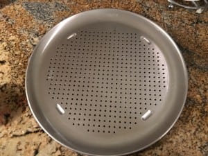 The holes are supposed to make the crust crispy