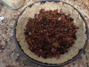 Bacon is the first layer on the bottom