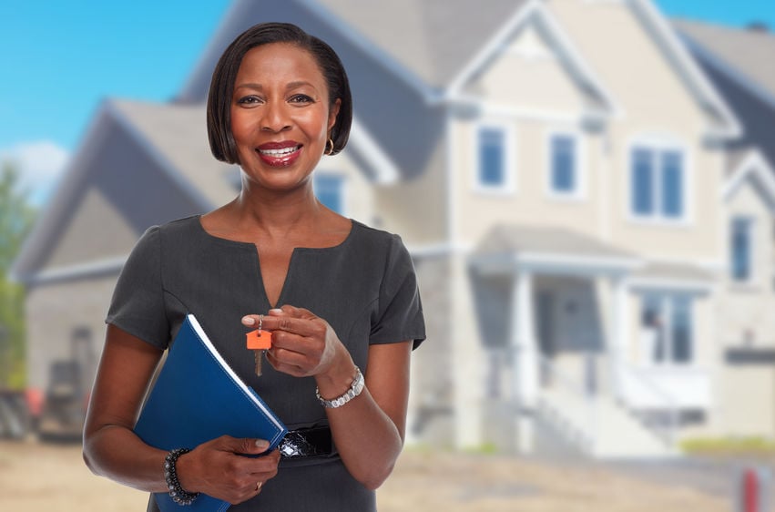 african american realtor woman with key.