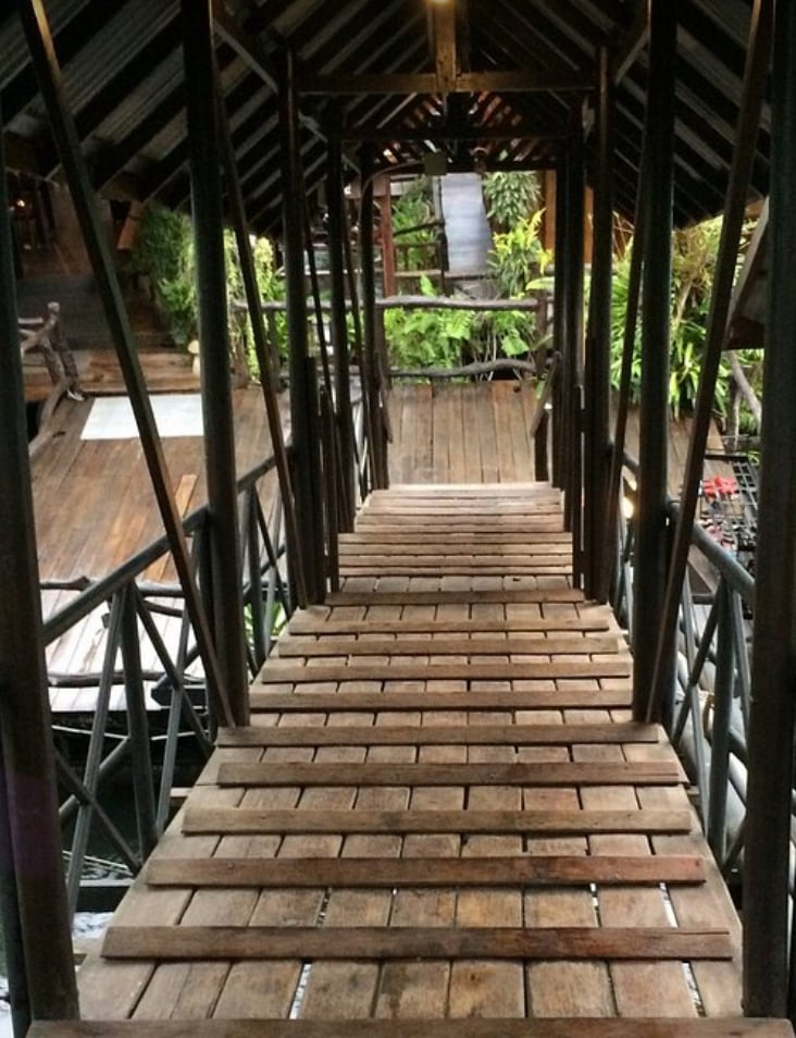 Walking from one raft to the next at River Kwai Jungle Rafts